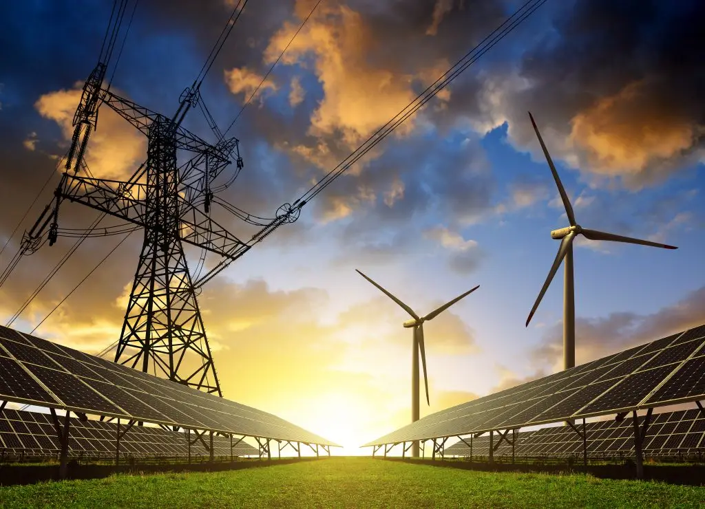 Solar panels with wind turbines and electricity pylon